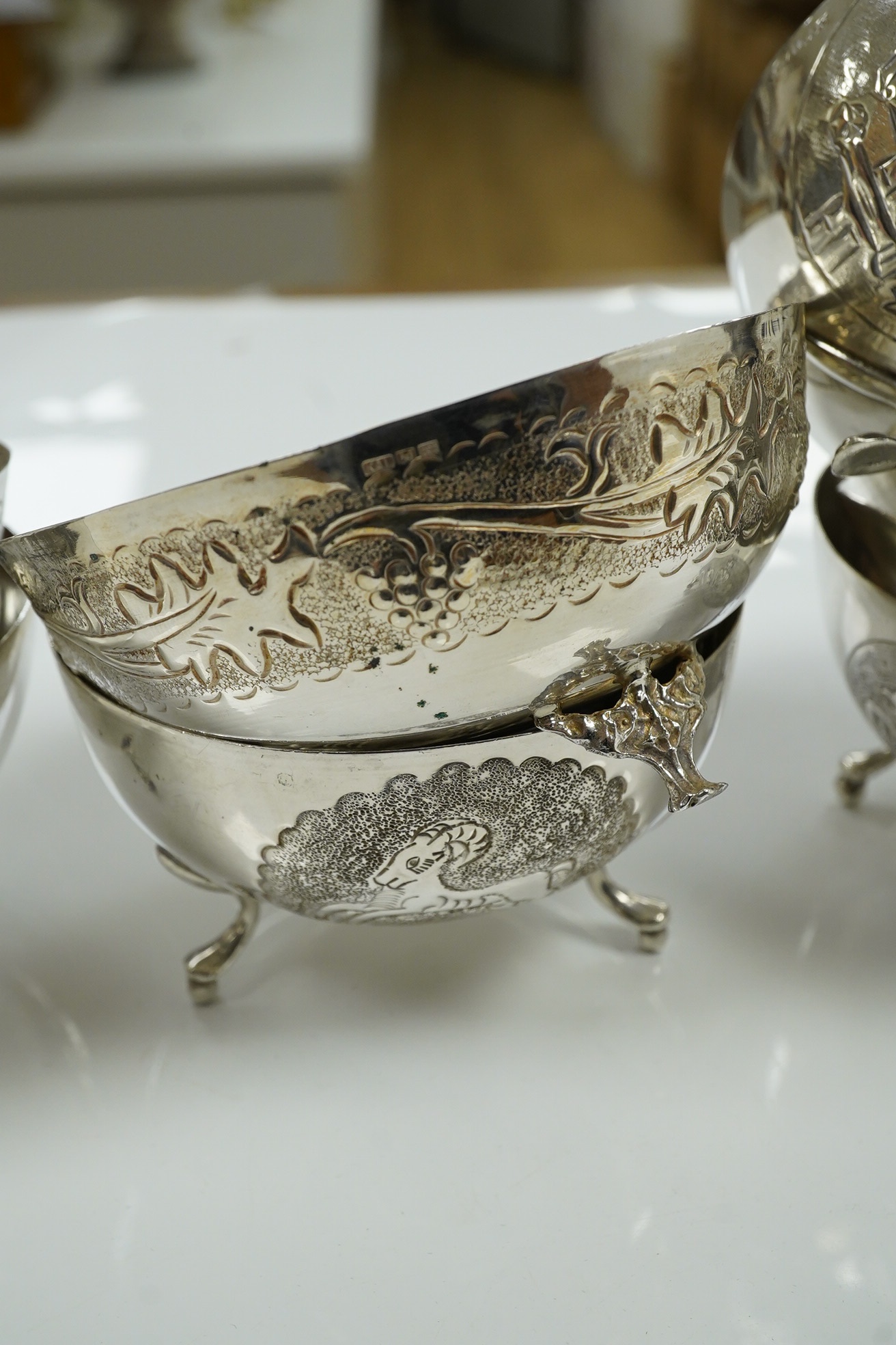 A set of nine Greek white metal footed bowls, stamped silver 830, 21.5 oz. Condition - good